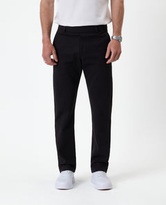 The Proper Pant Regular Fit in black — front view showing the clean straight leg silhouette