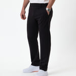 The Proper Pant Regular Fit in black — side view worn with white sneakers