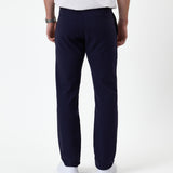 The Proper Pant Regular Fit in navy — back view showing the welt pockets and straight leg
