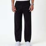 The Proper Pant Relaxed Straight Fit in black — front view worn with white sneakers