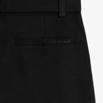 The Proper Pant Relaxed Straight Fit in black — back pocket with C'est normal logo.