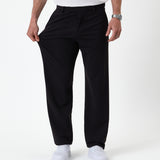The Proper Pant Relaxed Straight Fit in black — pulling the fabric to show the stretch