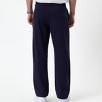 The Proper Pant Relaxed Straight Fit in navy — back view showing the relaxed silhouette
