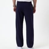 The Proper Pant Relaxed Straight Fit in navy — back view showing the relaxed silhouette