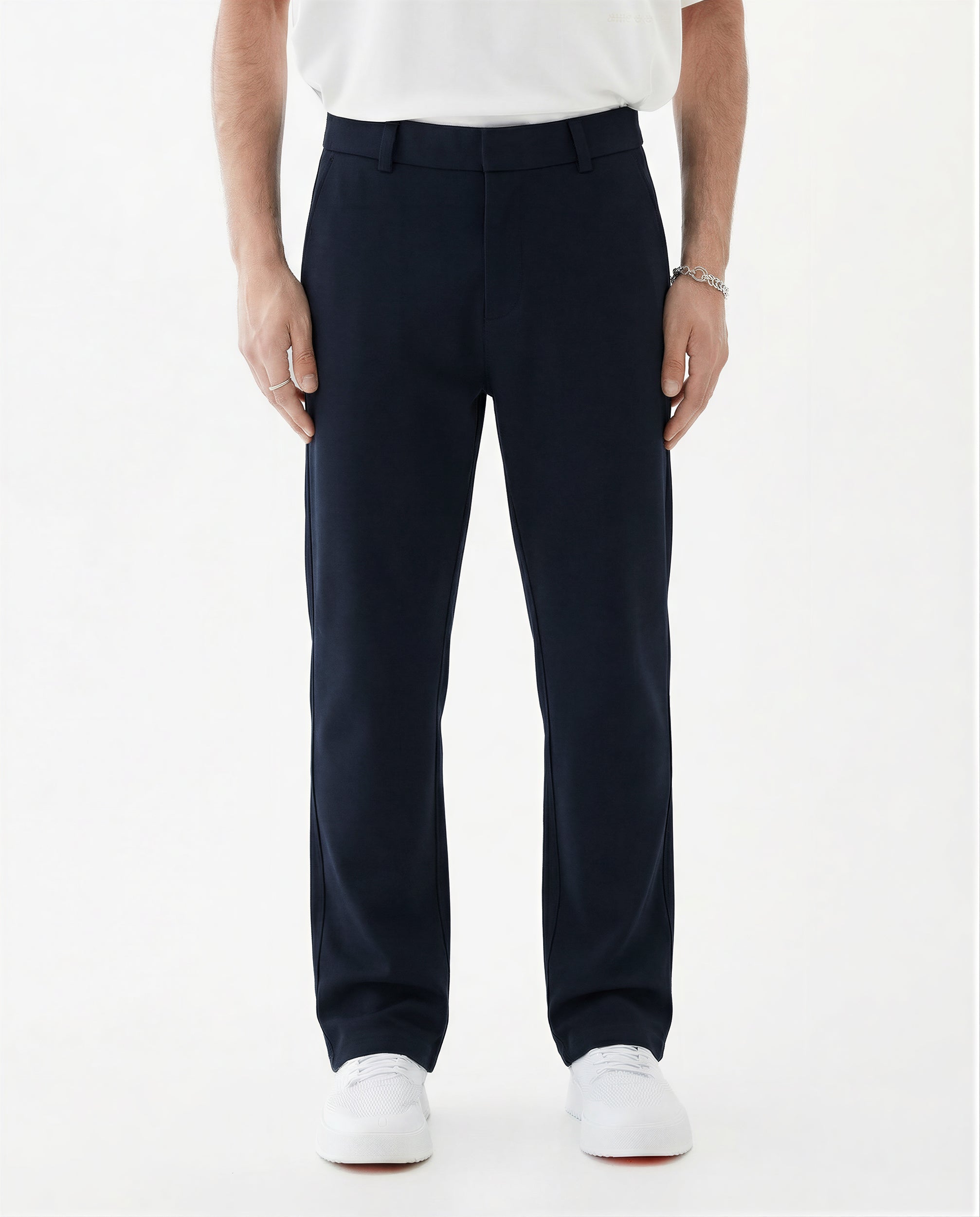 The Proper Pant Relaxed Straight Fit in navy — worn with white sneakers