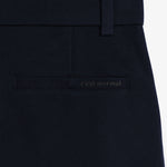 The Proper Pant Relaxed Straight Fit in navy — back pocket with C'est normal logo.