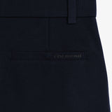 The Proper Pant Relaxed Straight Fit in navy — back pocket with C'est normal logo.