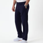 The Proper Pant Relaxed Straight Fit in navy — worn with white sneakers