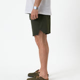 The Shorts in khaki — side view showing the notched hem and athletic fit