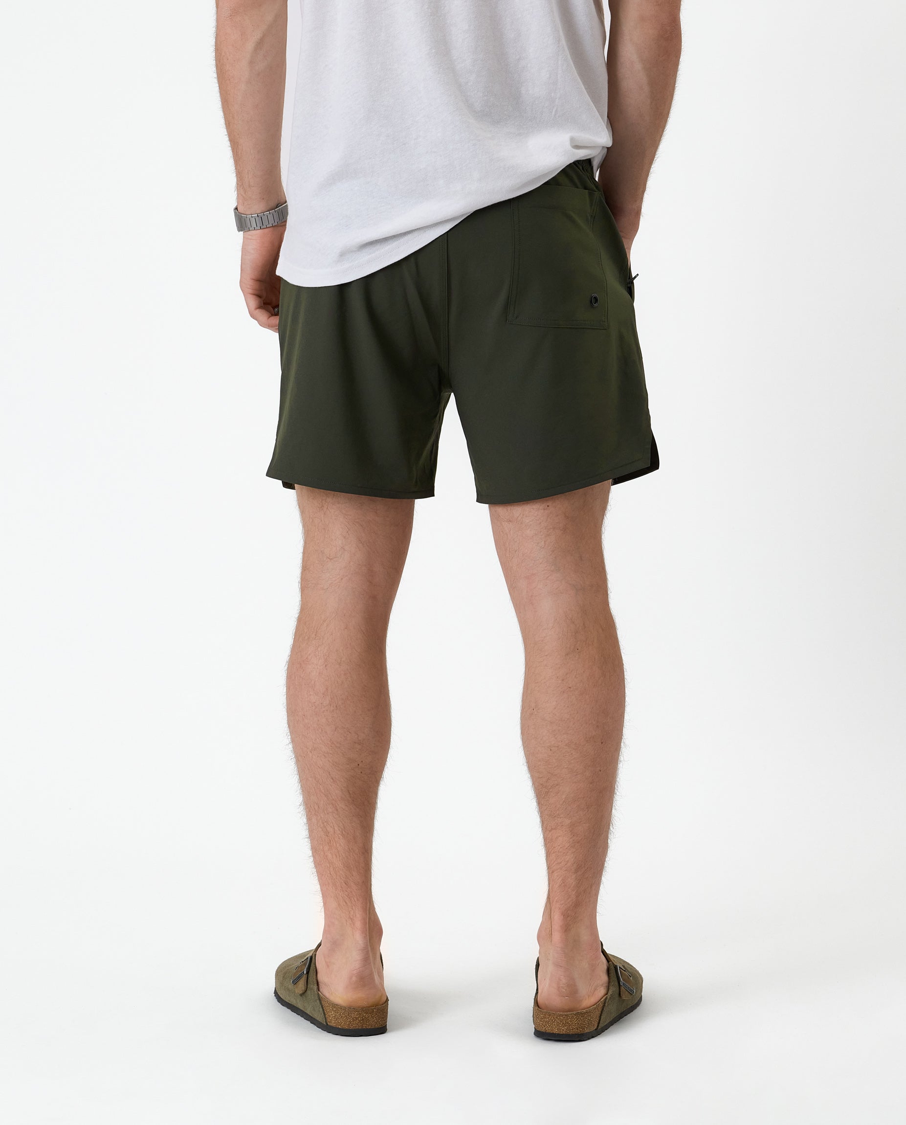 The Shorts in khaki — back view showing the pocket detail and notched hem