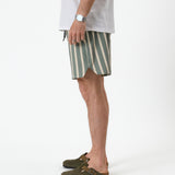 The Shorts in Lombok Stripe — side view showing the notched hem and vertical stripes