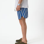 The Shorts in nautical stripe — side view showing the curved notched hem
