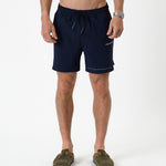 The Shorts in navy — front view with white C'est normal branding and drawstring