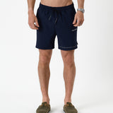 The Shorts in navy — front view with white C'est normal branding and drawstring