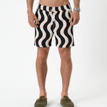 The Shorts in noir curl stripe — front view showing the wavy pattern and orange accents