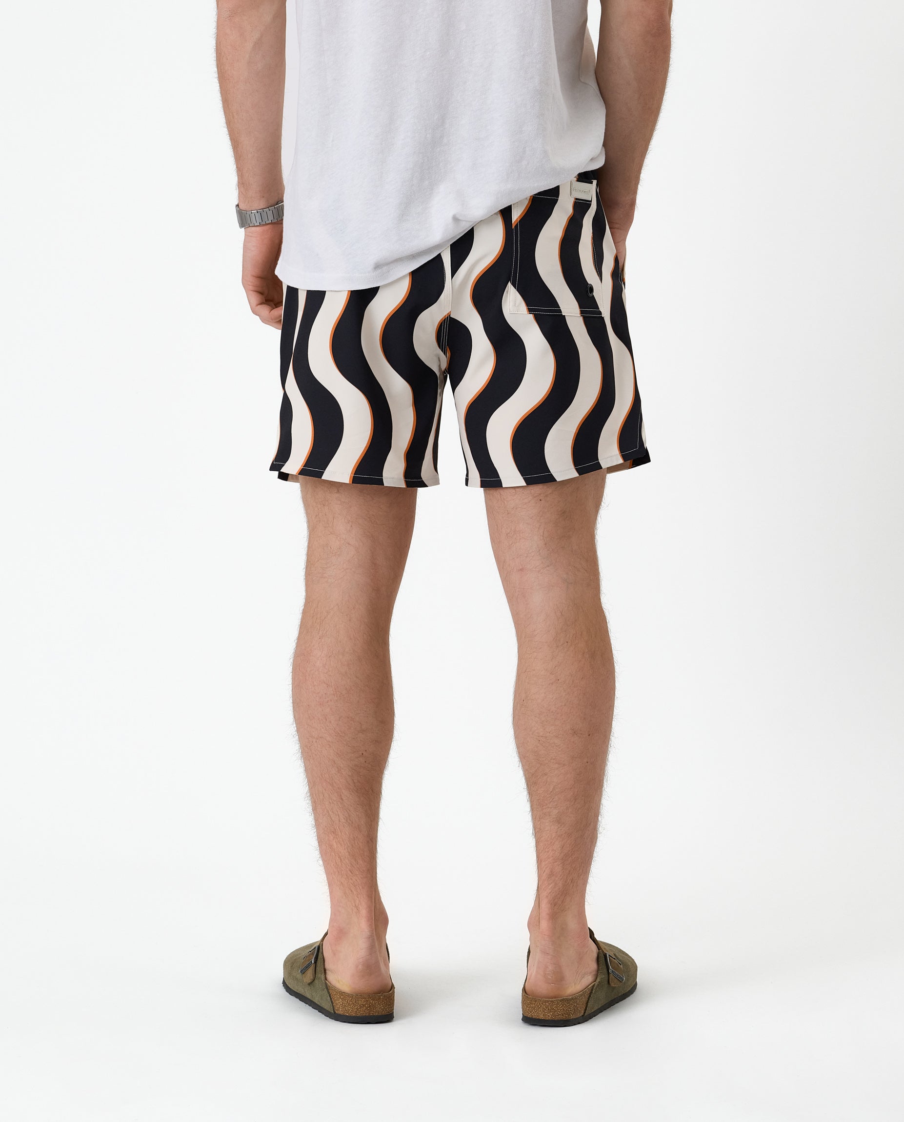 The Shorts in Noir Curl Stripe — back view showing the wavy graphic pattern