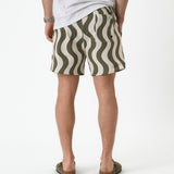 The Shorts in Olive Curl Stripe — back view showing the wavy pattern and pocket
