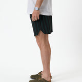 The Shorts in Phantom Stripe — side profile showing the vertical stripes and notched hem