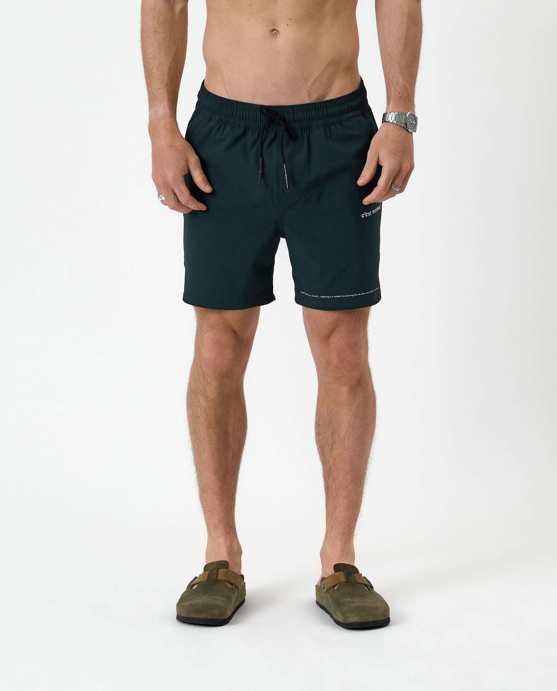 The Shorts in pine — front view worn with olive green clogs