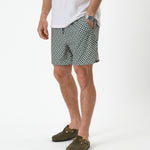 The Shorts in tile — worn with a white t-shirt and olive green clogs