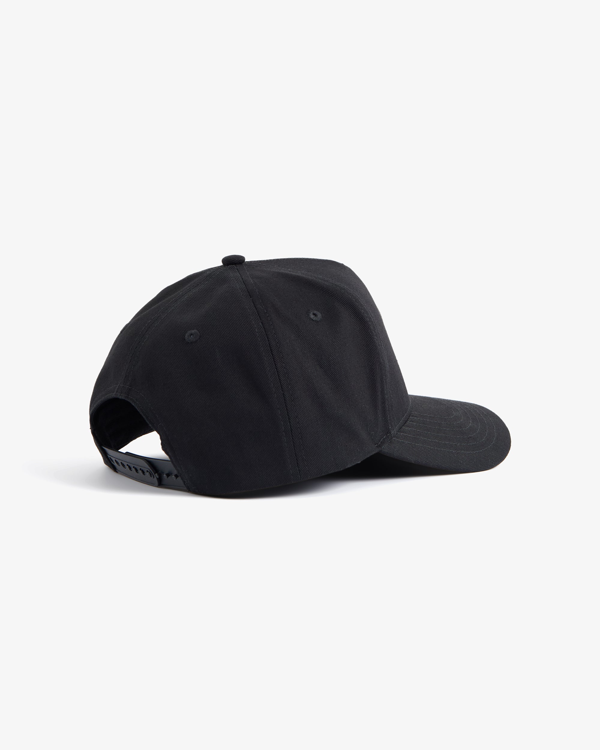A back view of The Snapback Cap in black, laid flat on a white background. The image highlights the adjustable snapback closure.