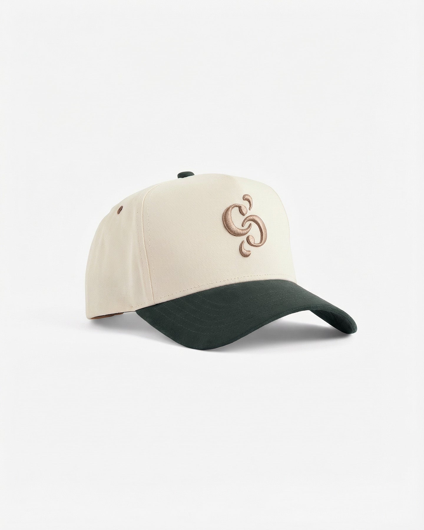 A front view of The Snapback Cap in Cream/Pine, laid flat on a white background. The image highlights the cream crown, pine green brim, and the embroidered c'est normal mirror logo on the front.