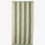 The Lombok Beach Towel in Lombok Stripe — full view showing green and cream vertical stripes