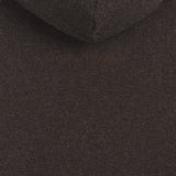 The Toulouse Hoodie in brown melange — close-up of the embroidered C'est normal logo on the back