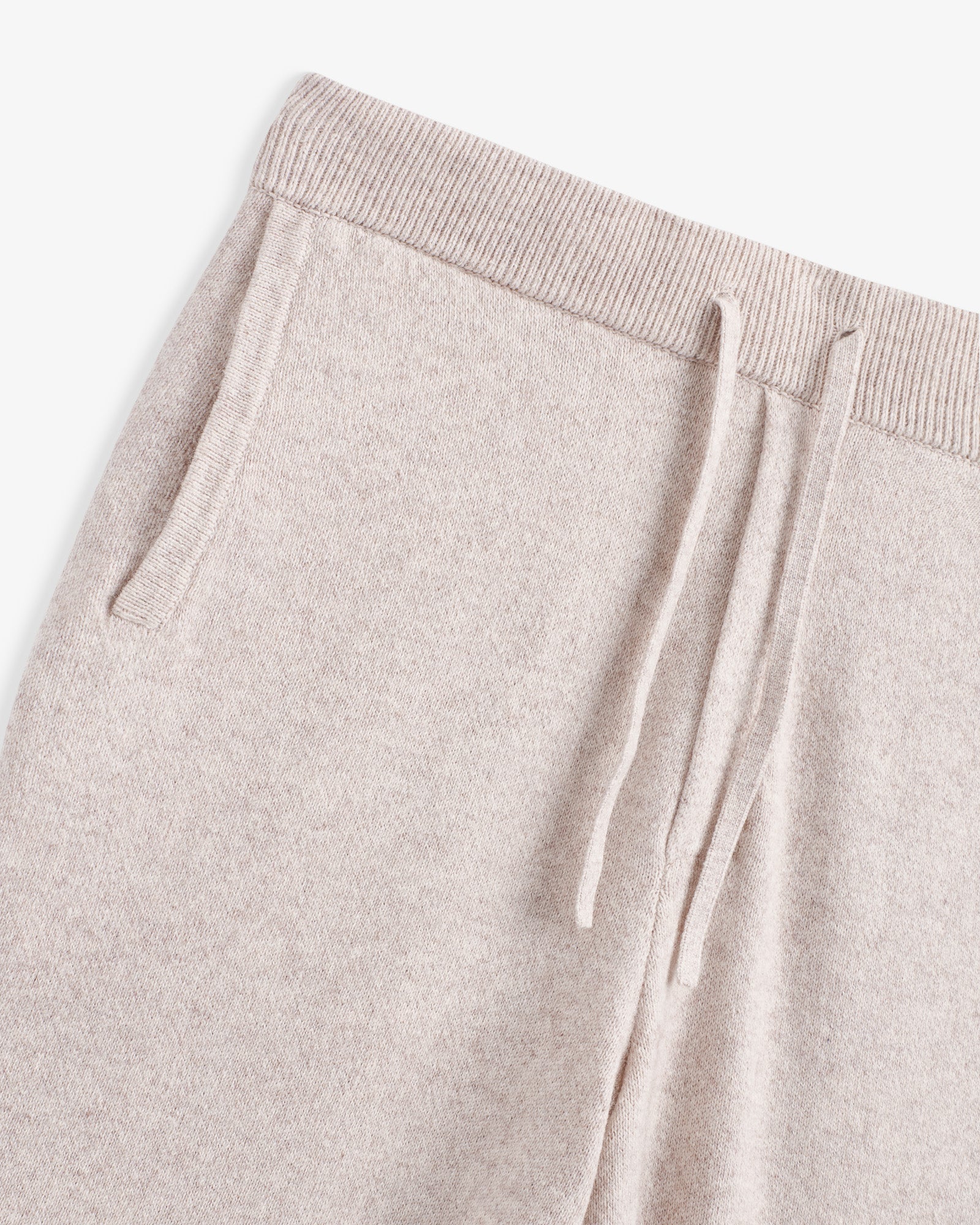 The Toulouse Pant in beige — close-up of the elastic drawstring waistband