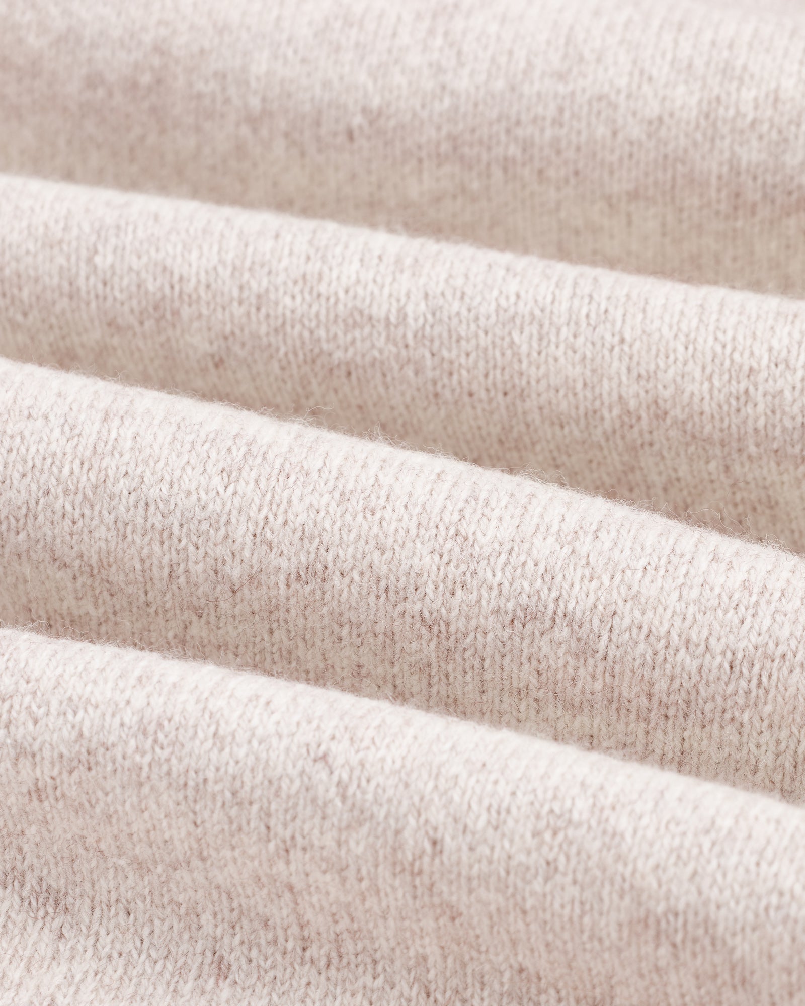The Toulouse Pant in beige — close-up of the knit fabric texture