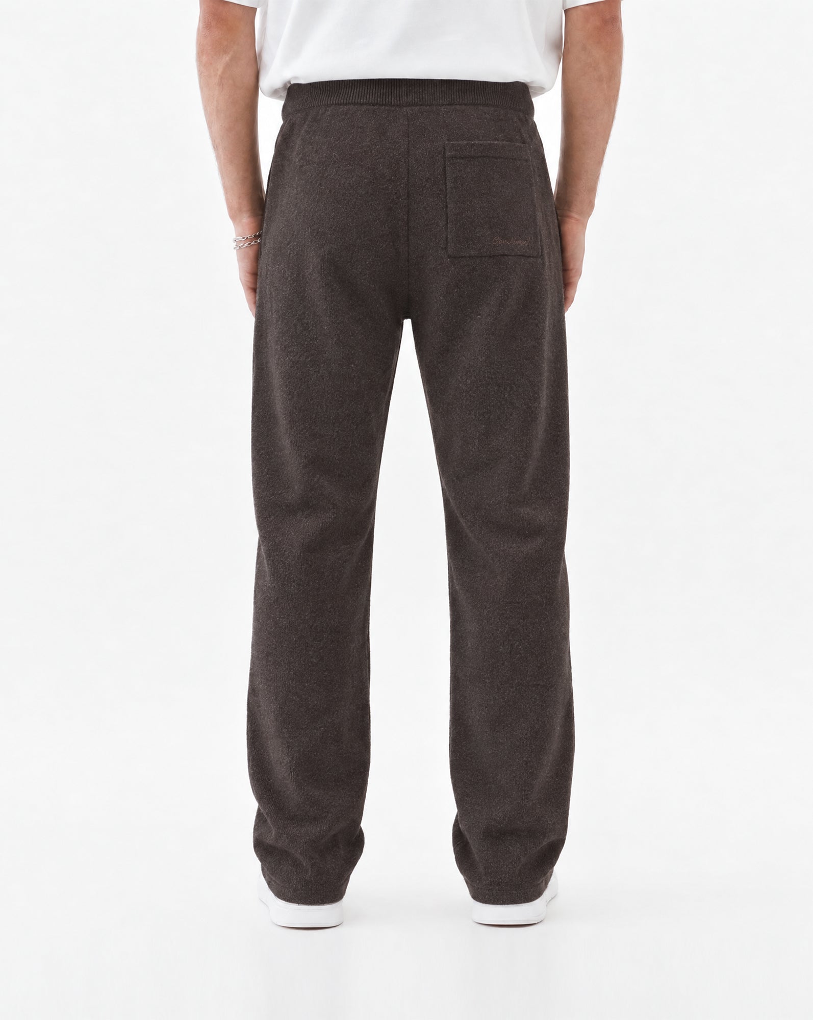 The Toulouse Pant in brown melange — back view showing the rear pocket
