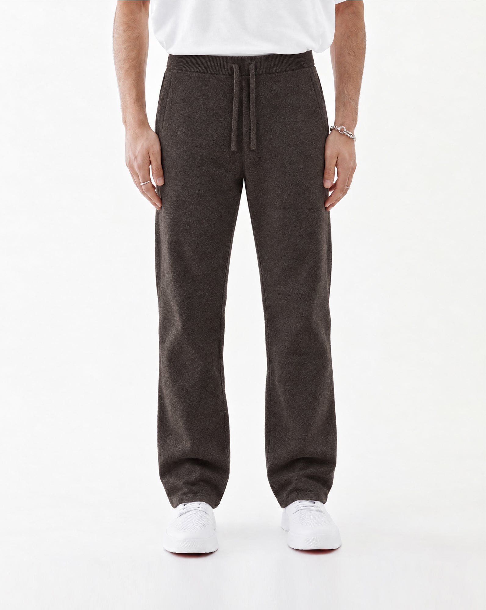 The Toulouse Pant in brown melange — worn with white sneakers