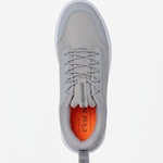 A top-down view of The Dynamic Waterproof Sneaker 2.0 Low in grey, laid flat on a white background. The image highlights the waterproof upper, laces, padded collar, and the bright orange insole featuring the c'est normal logo.