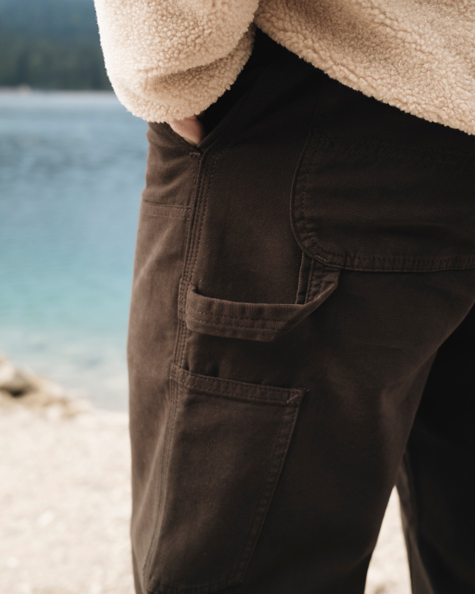 The Carpenter Pants in brown — close-up of the side pocket and hammer loop