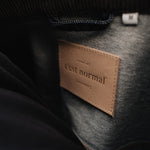 The Denim Jacket in rinse — close-up of the C'est normal neck label