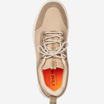 A top-down view of The Sneakers 2.0 Leather in Sand Leather, laid flat on a white background. The image highlights the tone-on-tone leather and suede upper, the laces, and the bright orange insole featuring the c'est normal logo.