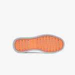 A bottom view of The Sneakers 2.0 in grey, laid flat against a white background. The image shows the EVA rubber grid sole in original orange with the c'est normal logo.