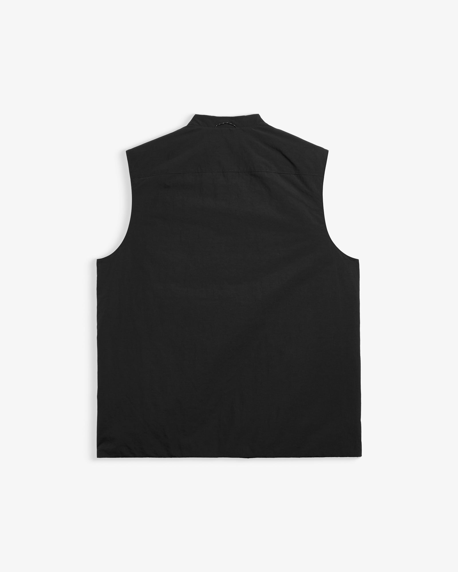 The Utility Vest in black — back view showing the clean tailored cut
