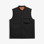 The Utility Vest in black — front view showing the chest pocket and snap button closure