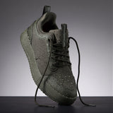 The Dynamic Waterproof Sneaker 2.0 Low in khaki — angled view covered in water droplets