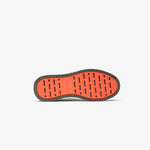 The Dynamic Waterproof Sneaker 2.0 Low in khaki — bottom view of the orange rubber grid sole
