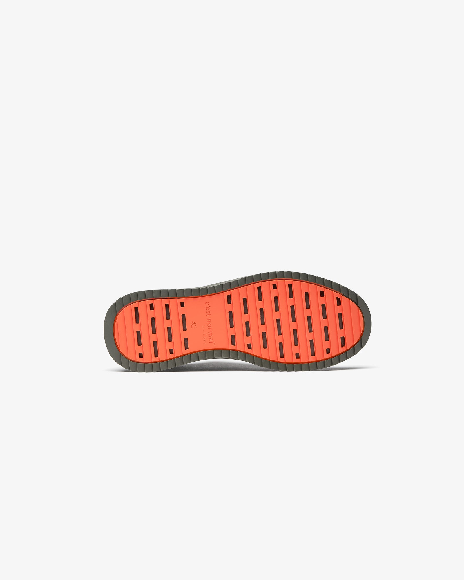 The Dynamic Waterproof Sneaker 2.0 Low in khaki — bottom view of the orange rubber grid sole