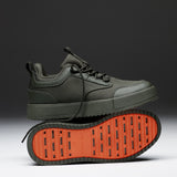 The Dynamic Waterproof Sneaker 2.0 Low in khaki — side view showing the orange rubber grid sole