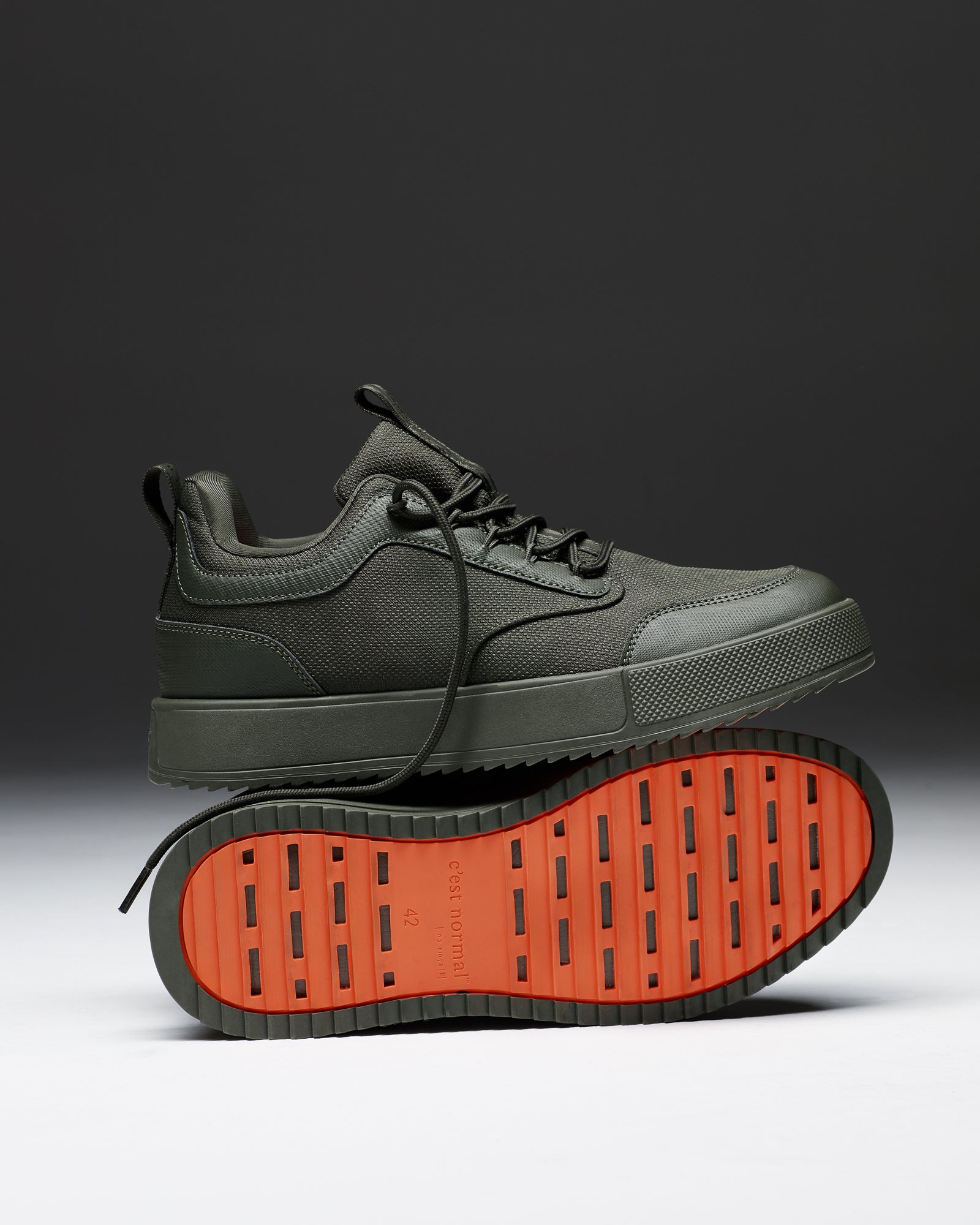 The Dynamic Waterproof Sneaker 2.0 Low in khaki — side view showing the orange rubber grid sole