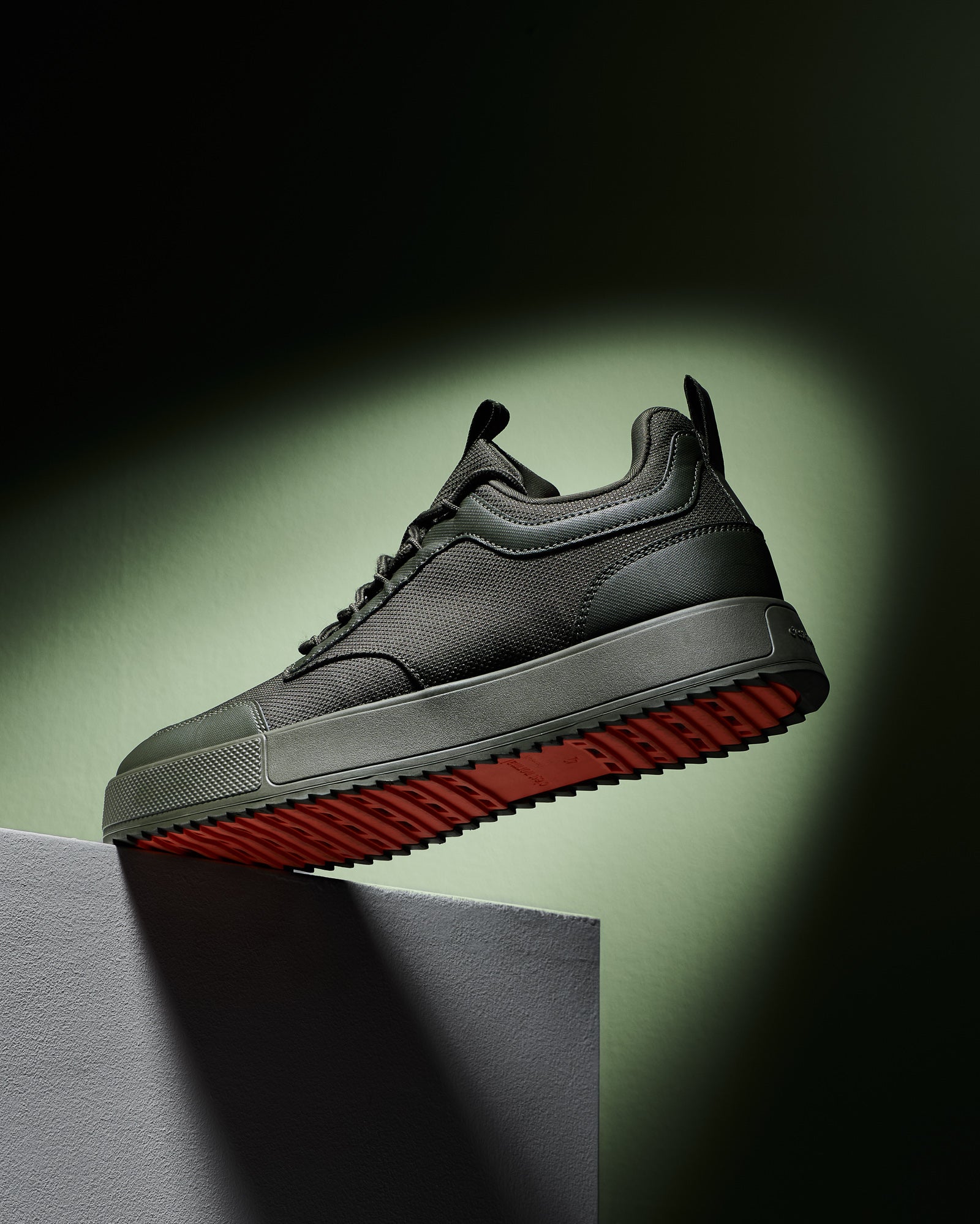 The Dynamic Waterproof Sneaker 2.0 Low in khaki — side view showing the orange rubber sole